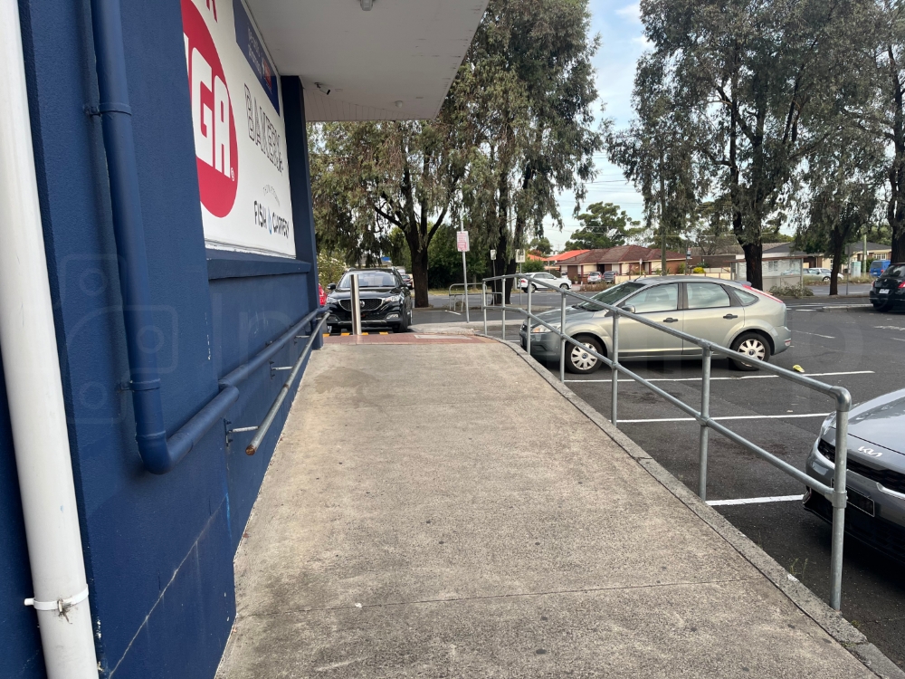 Galvanised key clamp handrail constructed at a retail park offering fall protection